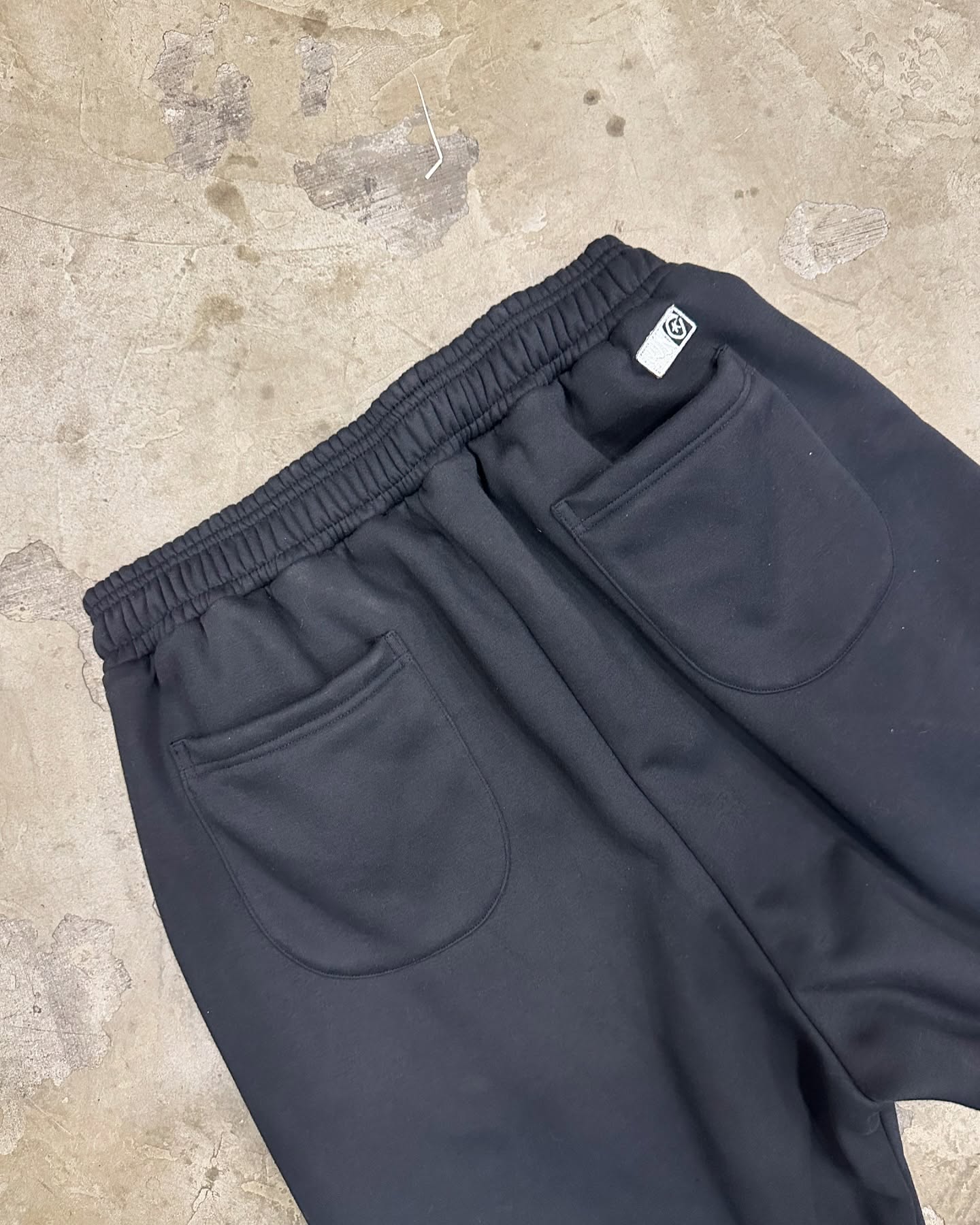 STRAIGHT LEG PLEATED SWEATS - BLACK